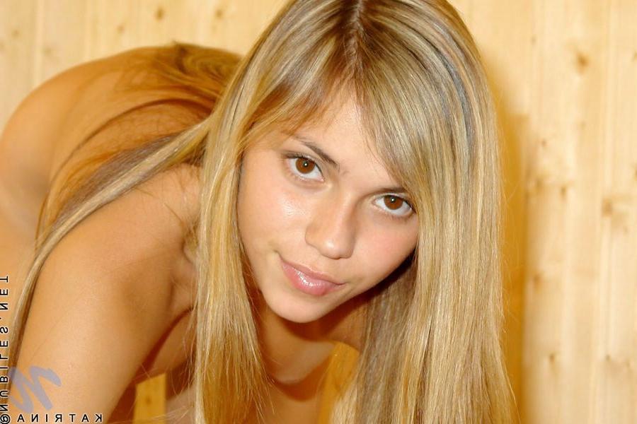 15P Super petite blonde Katrina posing in on top of table
