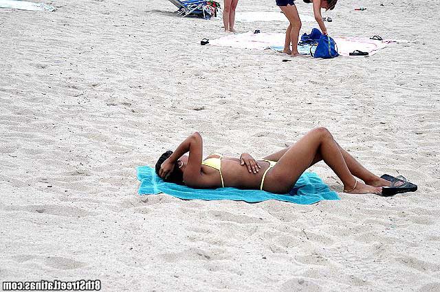 15P Bikini wearing ebony latina gets on her knees to suck