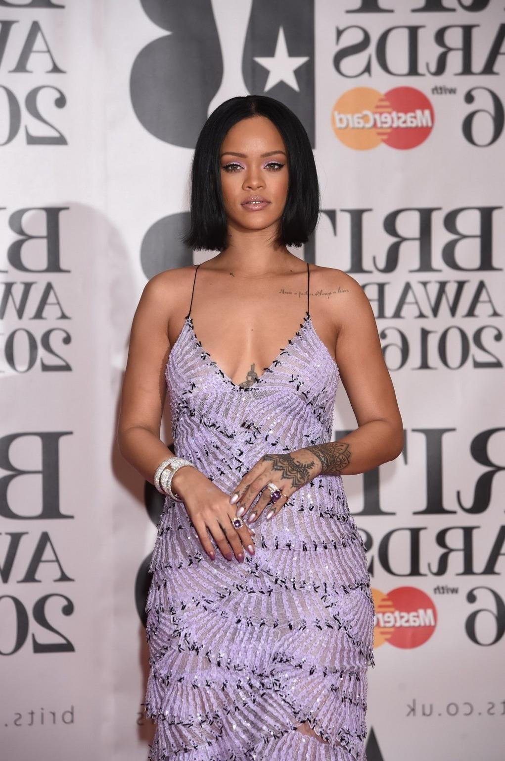 16P Rihanna braless in slightly see through maxi dress