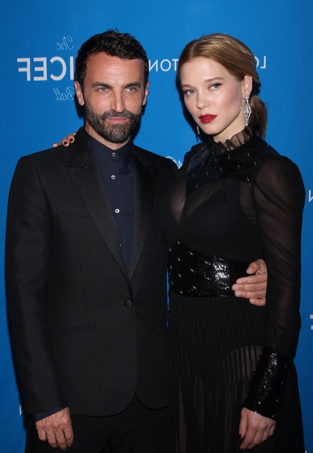 16P Lea Seydoux busty and leggy in black see through dress