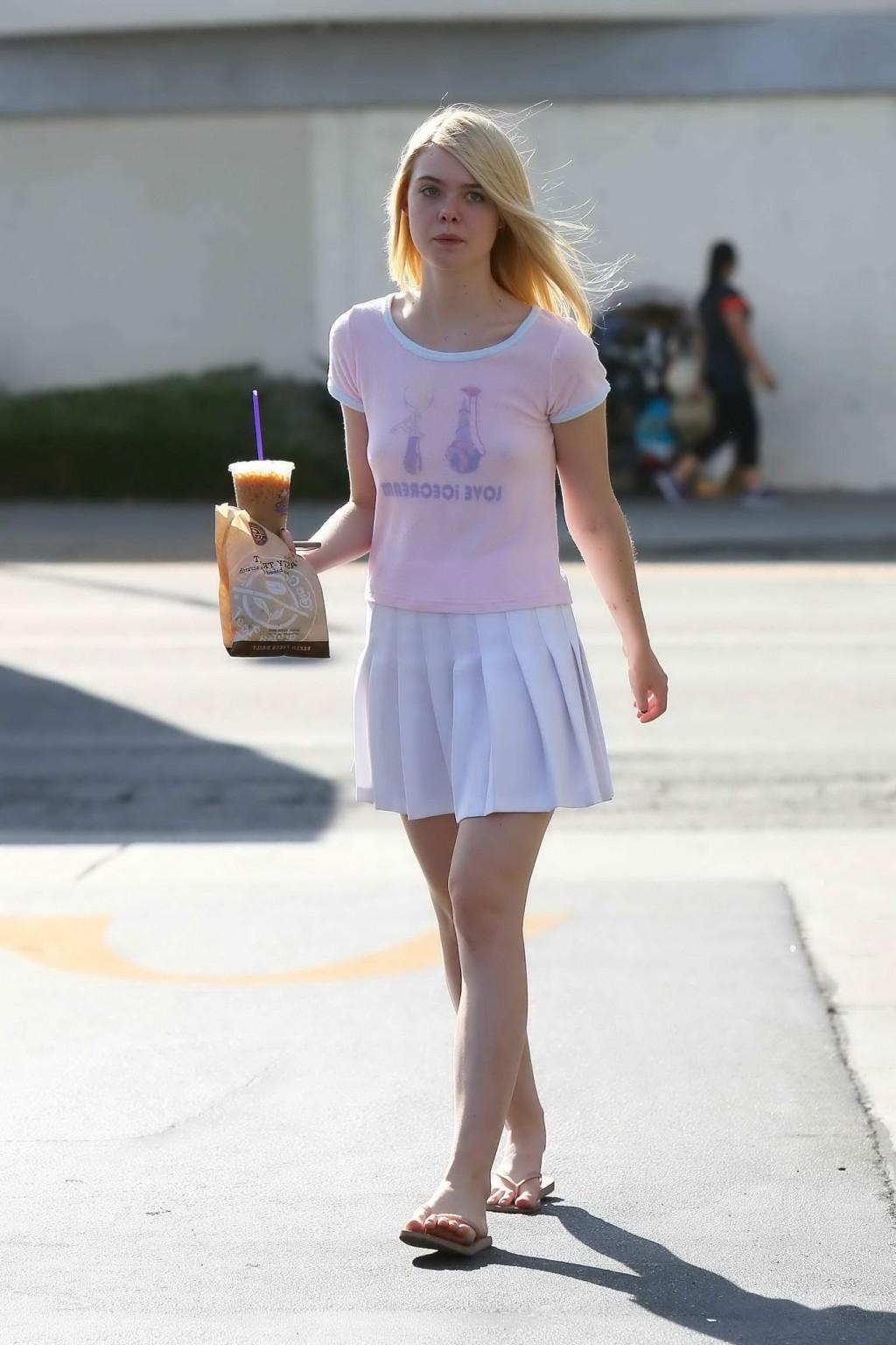 16P Elle Fanning showing pokies in a see through top