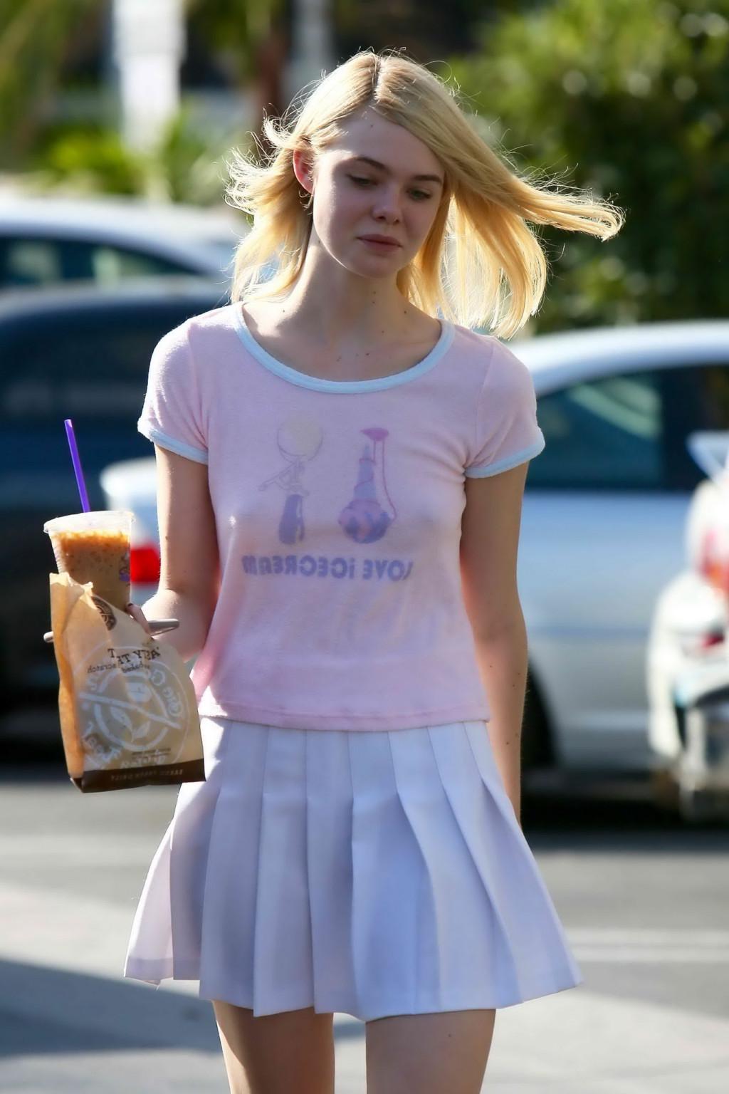 16P Elle Fanning showing pokies in a see through top