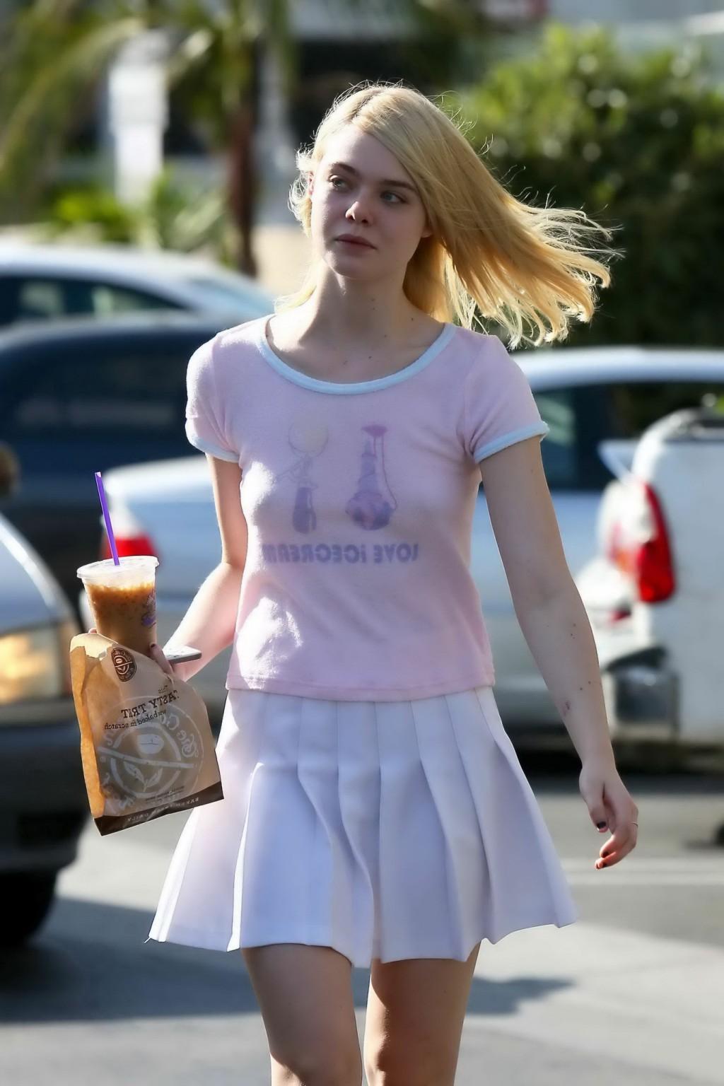 16P Elle Fanning showing pokies in a see through top