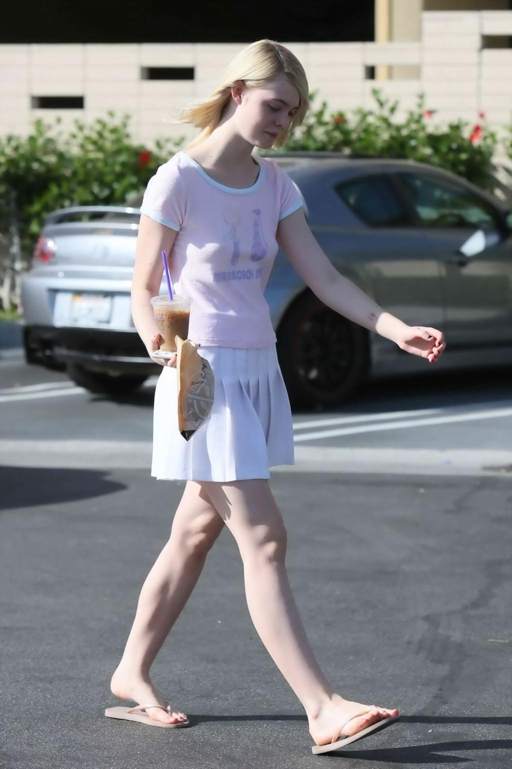 16P Elle Fanning showing pokies in a see through top