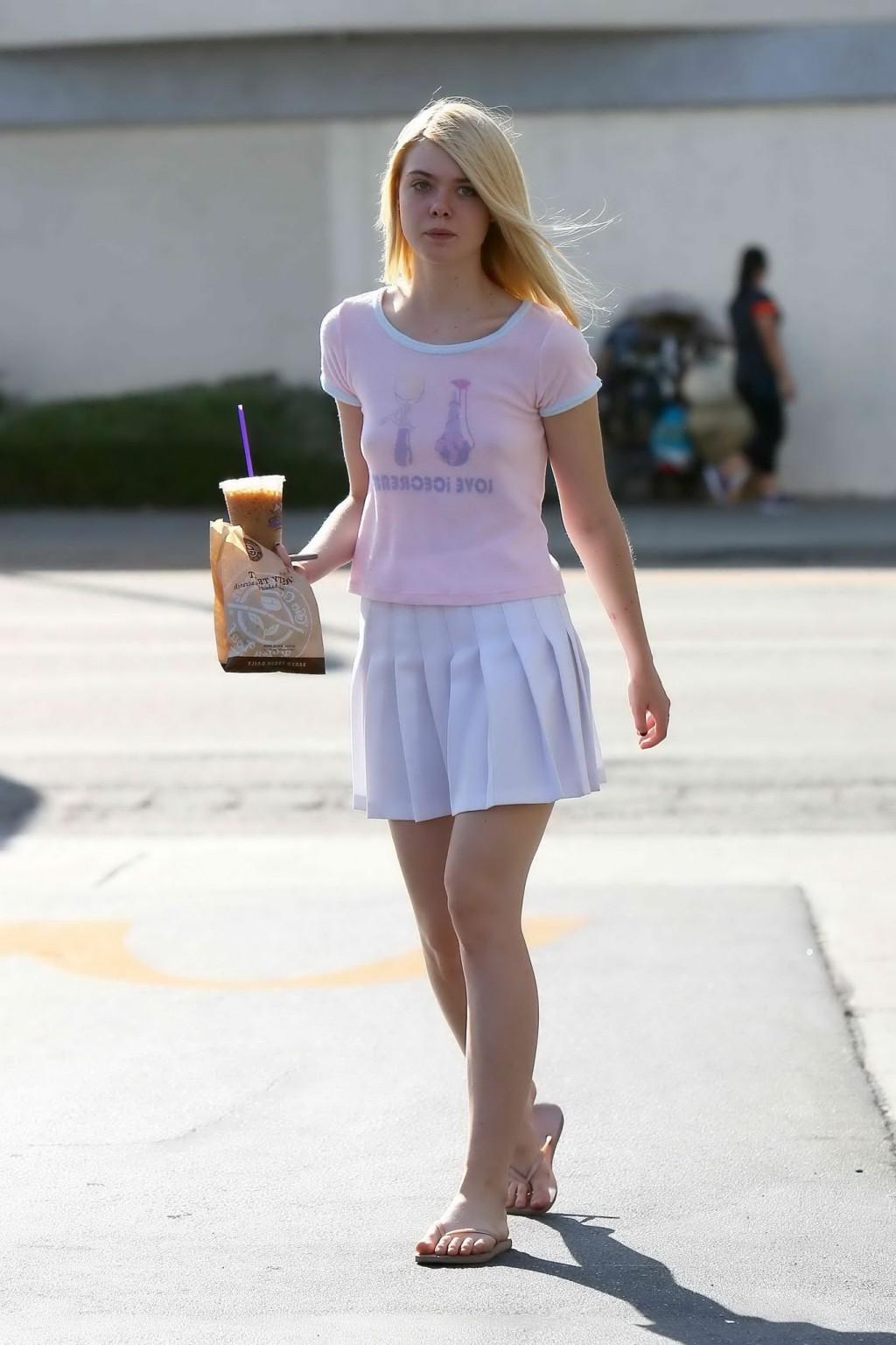 16P Elle Fanning showing pokies in a see through top