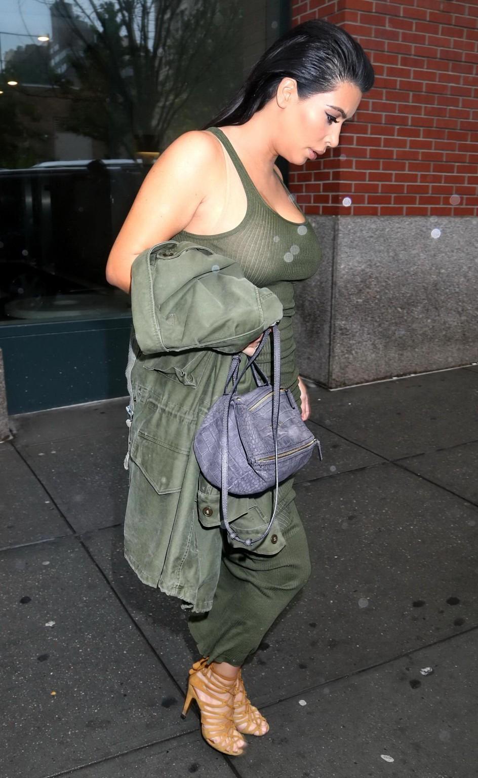 16P Kim Kardashian pantyless shows off her ass wearing a see through dress out in NY