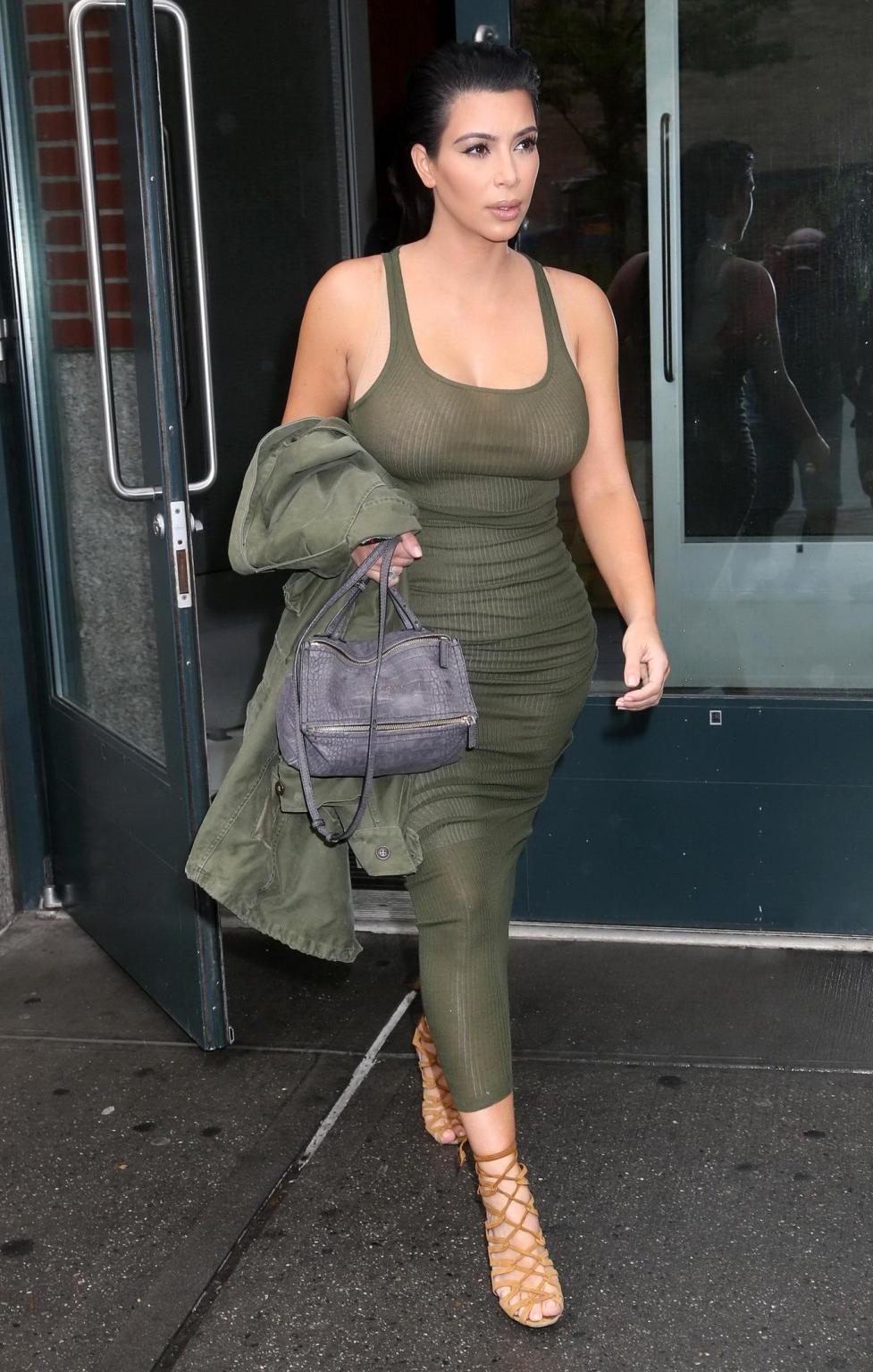 16P Kim Kardashian pantyless shows off her ass wearing a see through dress out in NY