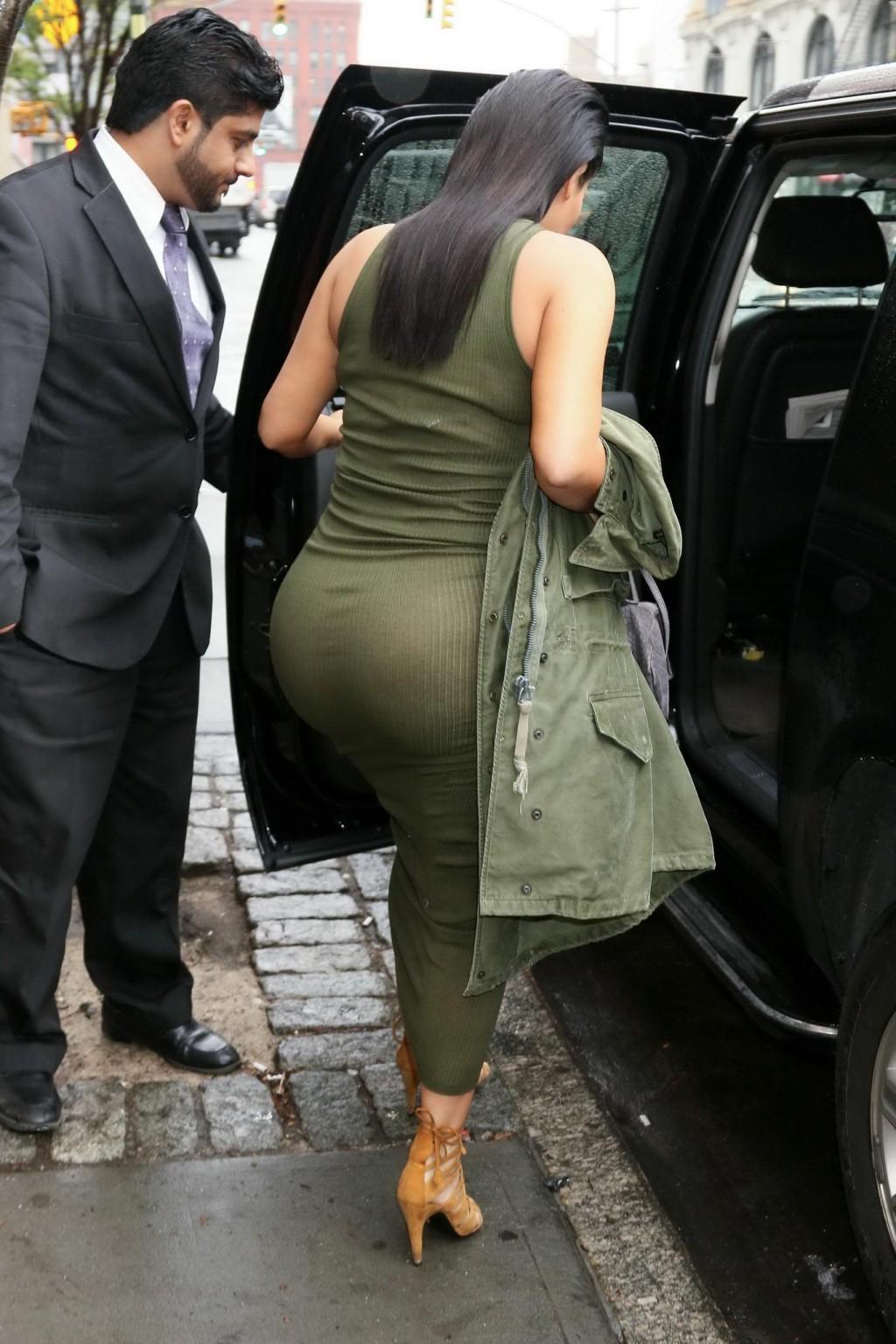 16P Kim Kardashian pantyless shows off her ass wearing a see through dress out in NY
