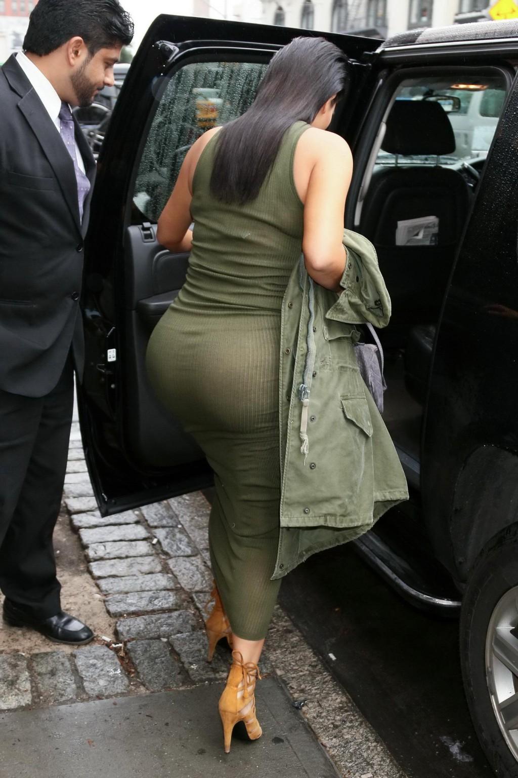 16P Kim Kardashian pantyless shows off her ass wearing a see through dress out in NY