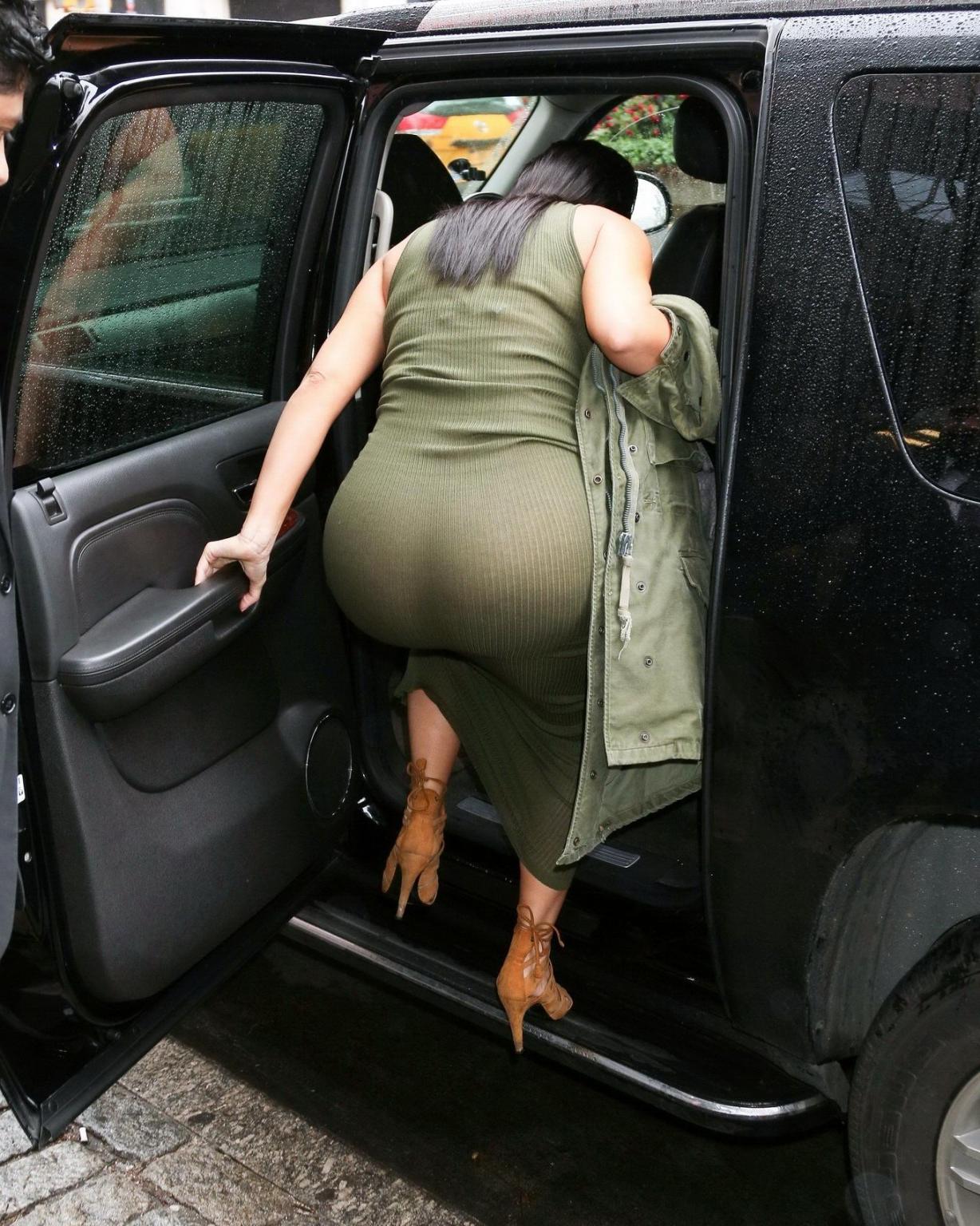 16P Kim Kardashian pantyless shows off her ass wearing a see through dress out in NY