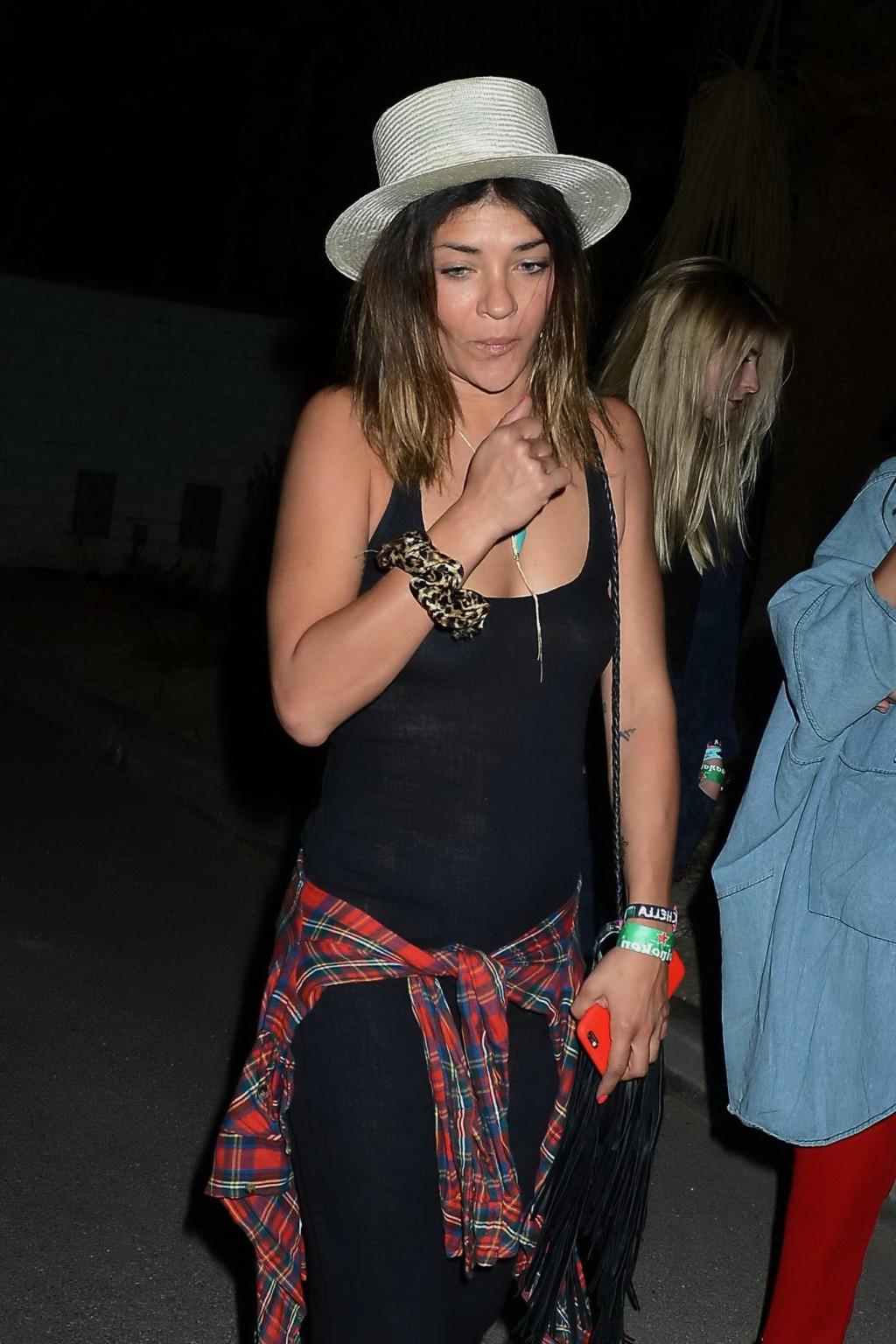16P Jessica Szohr showing boobs braless in black see through dress at Coachella Musi