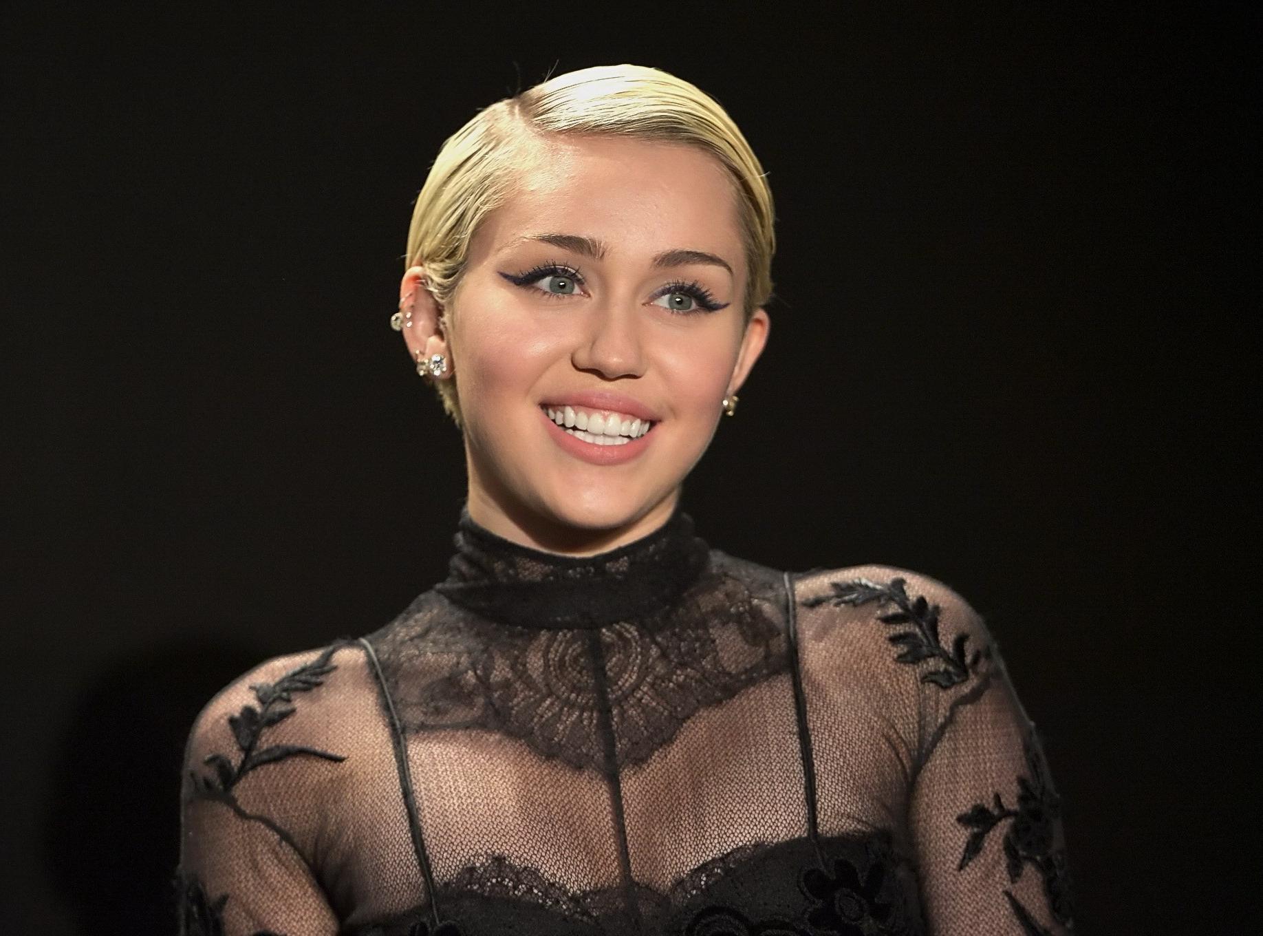 16P Miley Cyrus wearing see through dress and lingerie at Tom Ford 2015 Womenswear C