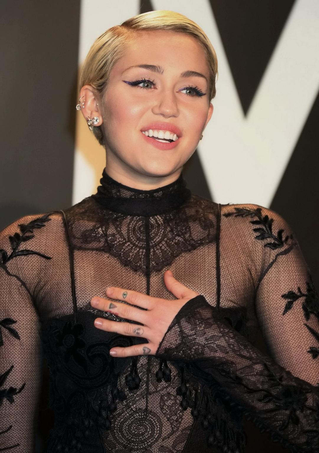 16P Miley Cyrus wearing see through dress and lingerie at Tom Ford 2015 Womenswear C