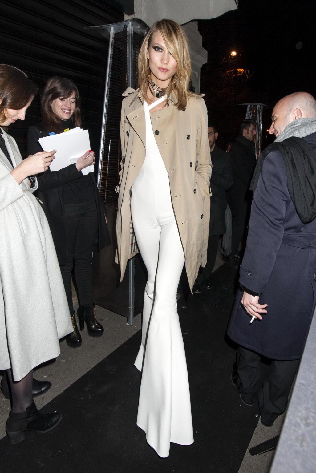 16P Karlie Kloss areola peek wearing a partially see through jumpsuit at the Versace