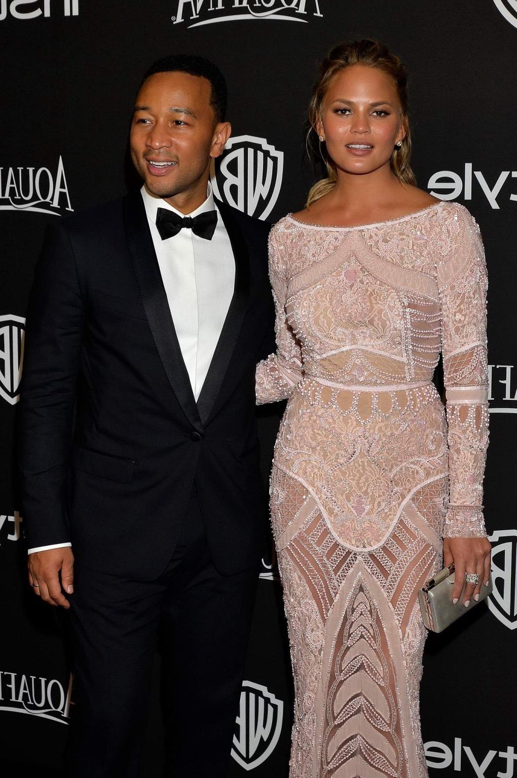 16P Chrissy Teigen shows off her big boobs wearing a see through dress at the InStyl