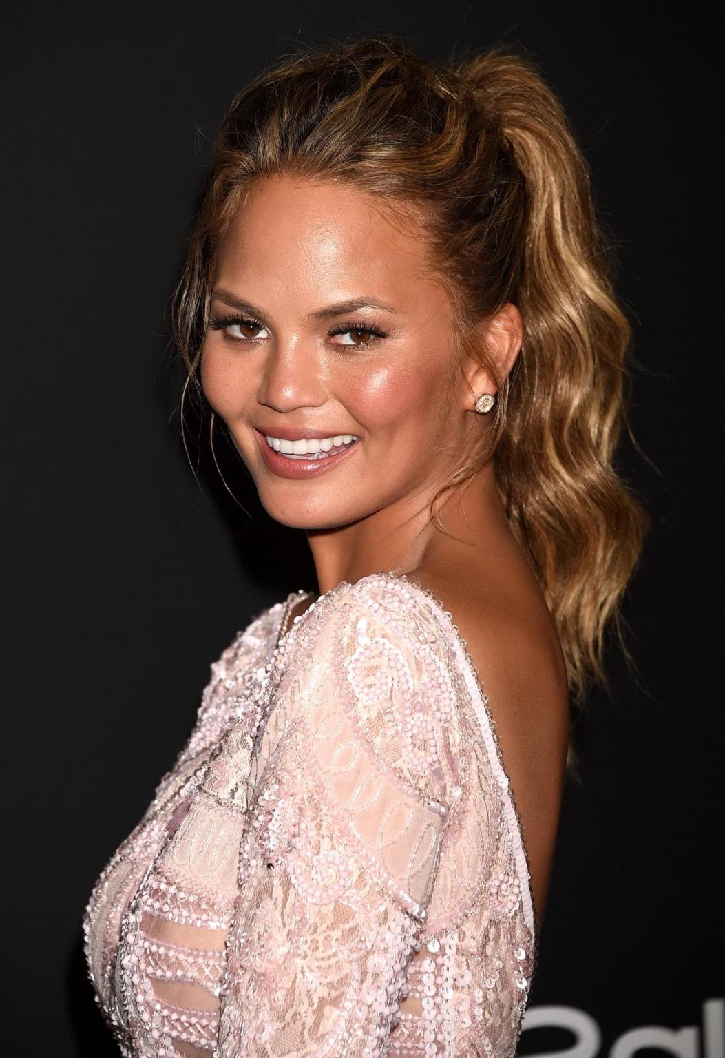 16P Chrissy Teigen shows off her big boobs wearing a see through dress at the InStyl