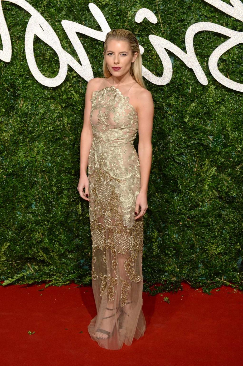16P Mollie King braless wearing a partially see through dress at the British Fashion