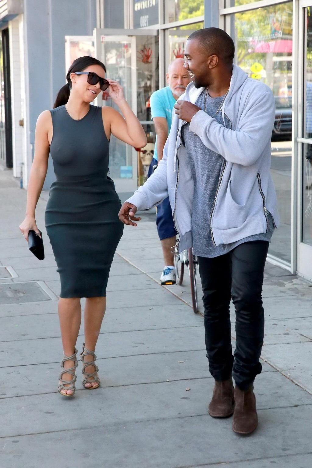 10P Kim Kardashian shows off her booty and big boobs in see through top while out sh