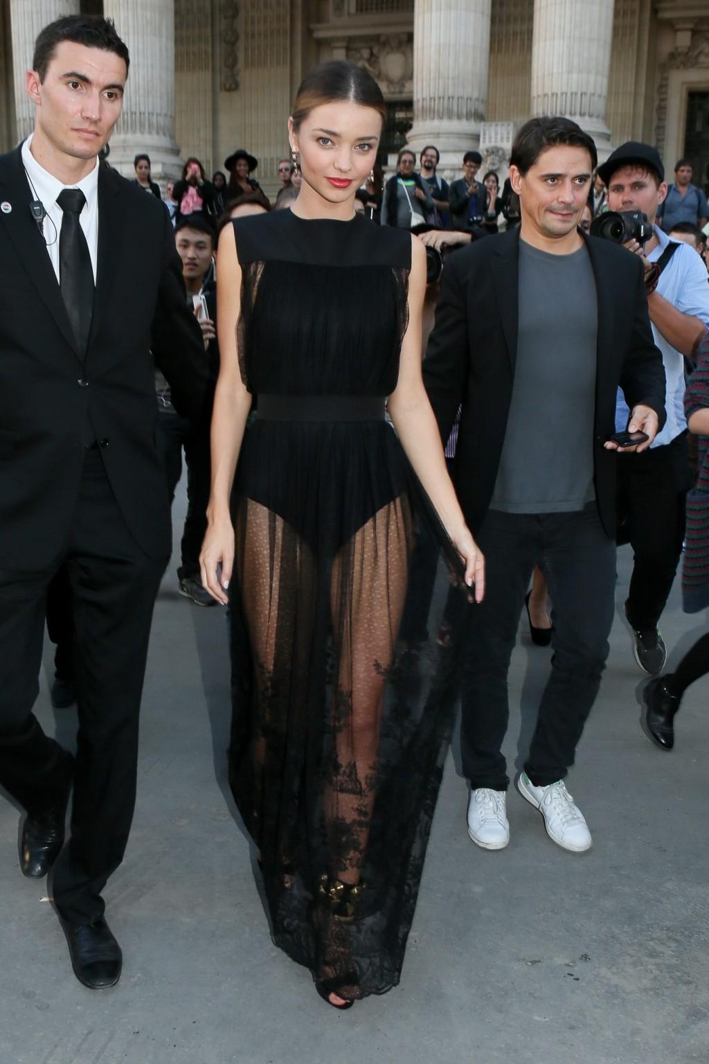 16P Miranda Kerr shows off her legs and ass wearing a partially see through dress at