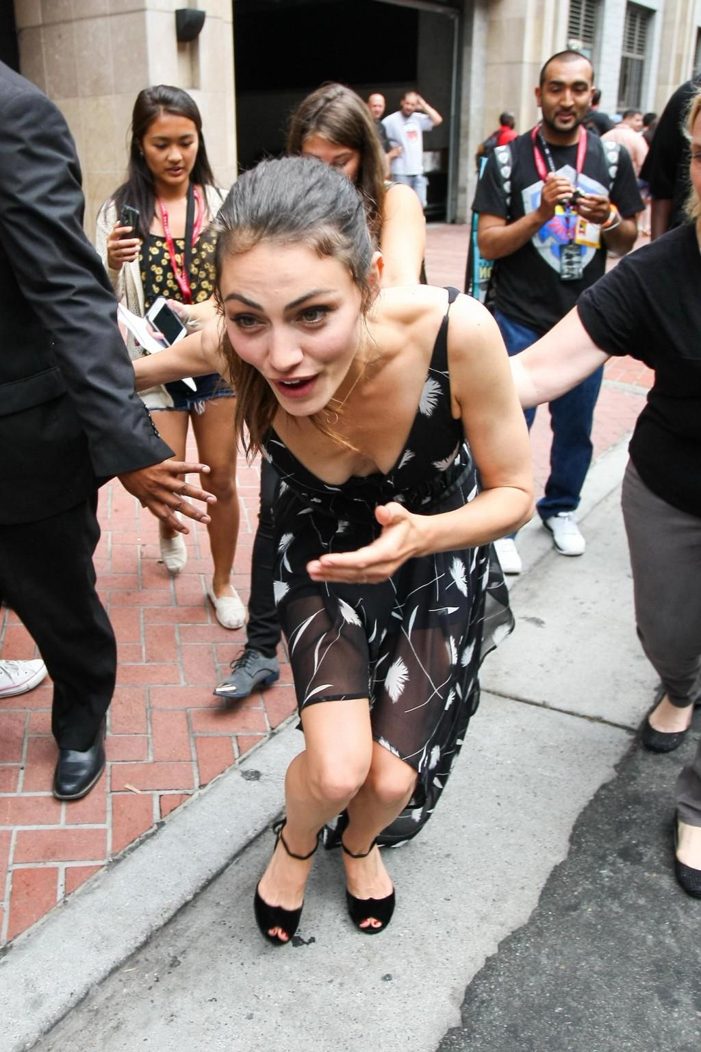 15P Phoebe Tonkin braless downblouse while loosing balance at Comic Con in San Diego