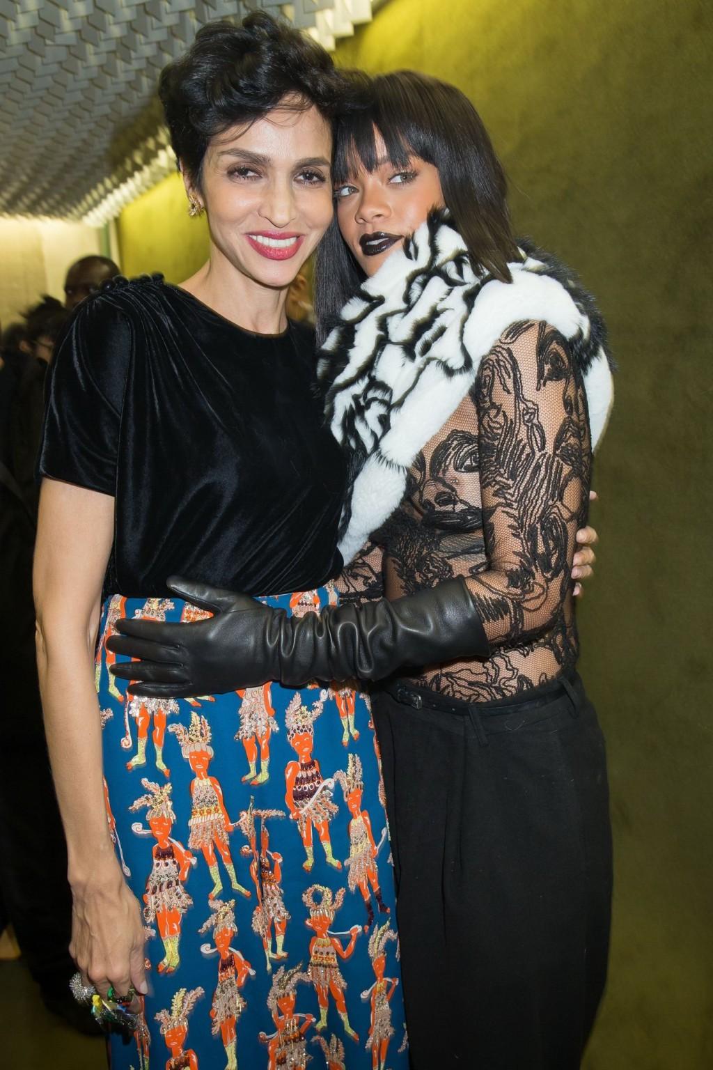16P Rihanna braless in a black see-through top at Jean Paul Gaultier fashion show in