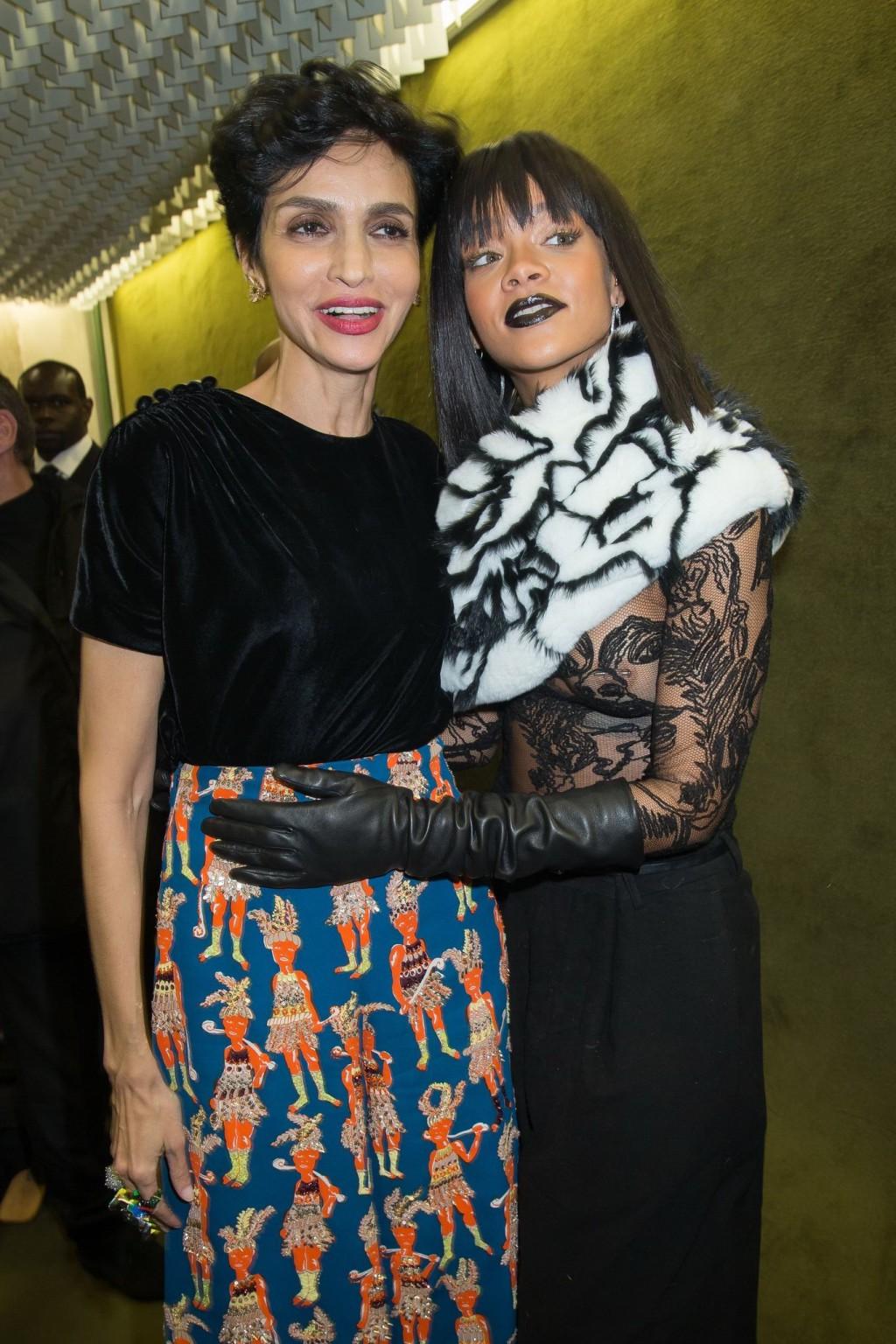 16P Rihanna braless in a black see-through top at Jean Paul Gaultier fashion show in