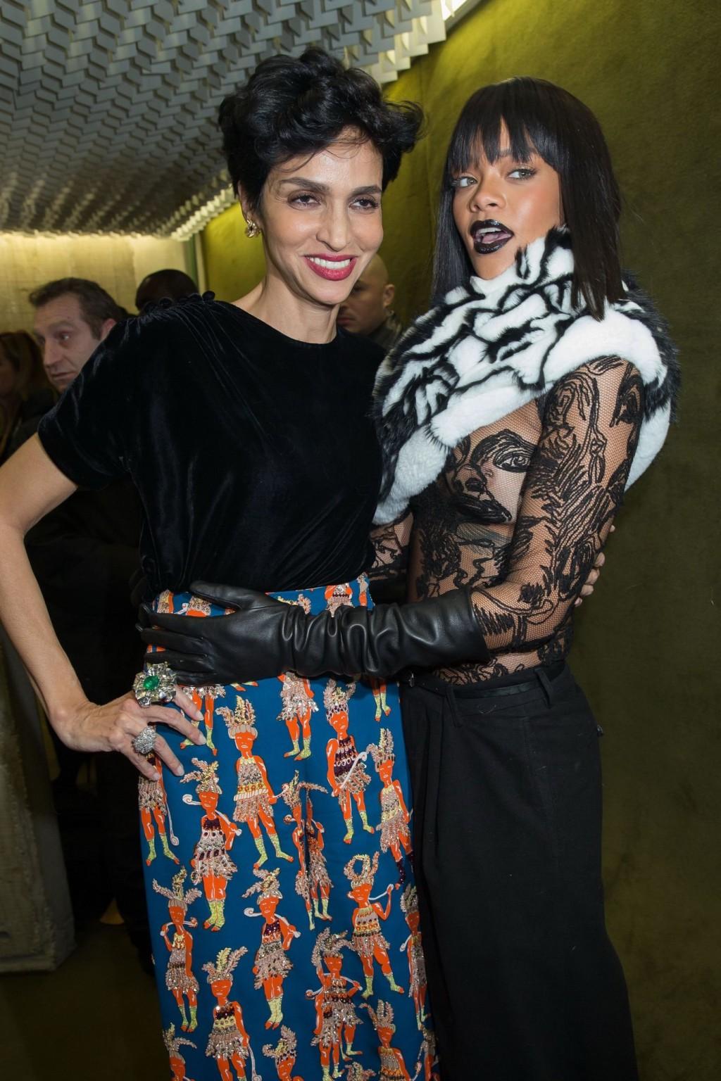 16P Rihanna braless in a black see-through top at Jean Paul Gaultier fashion show in