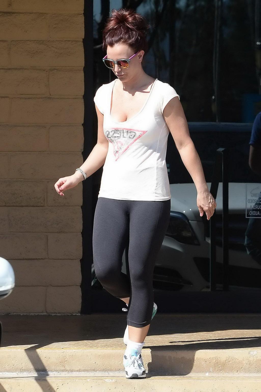 16P Britney Spears wearing white see-through top and leggings while visiting Tan-Xs 