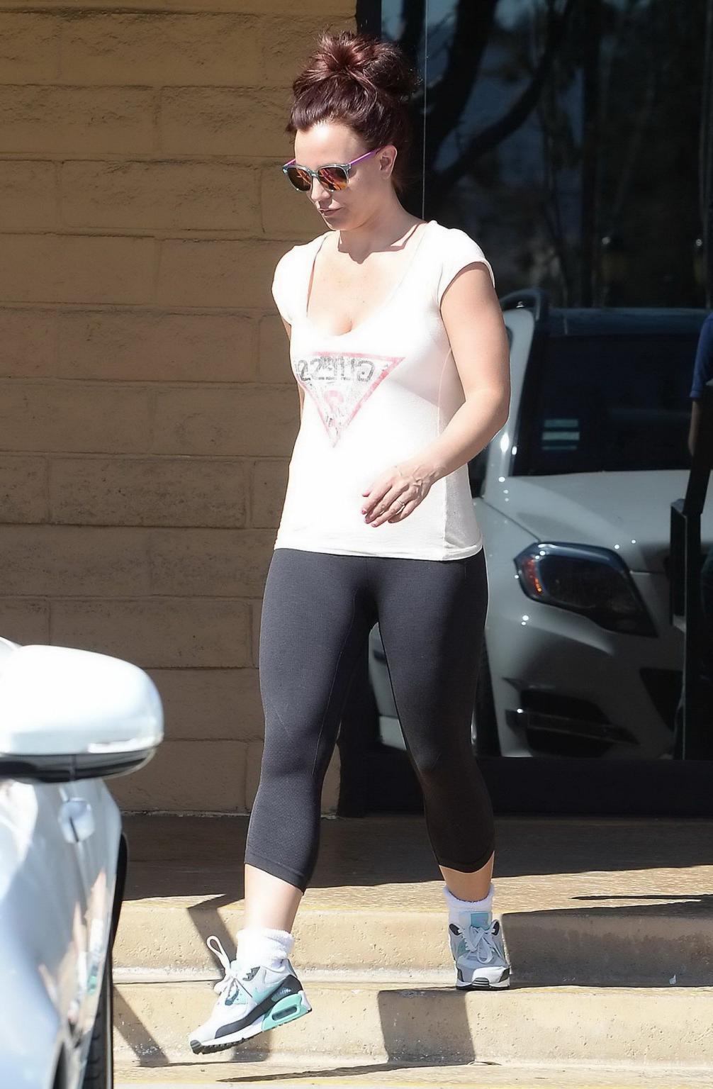 16P Britney Spears wearing white see-through top and leggings while visiting Tan-Xs 