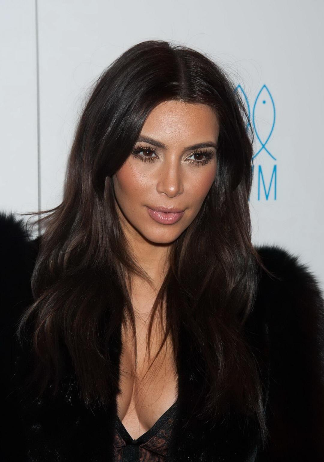 16P Kim Kardashian braless wearing low cut see-through top and skirt at Generation N