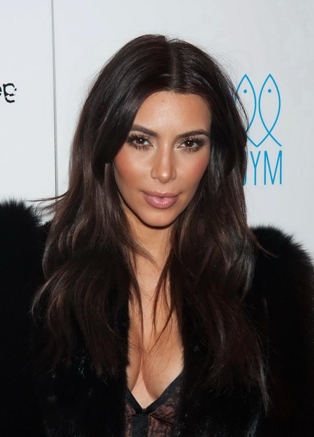 16P Kim Kardashian braless wearing low cut see-through top and skirt at Generation N