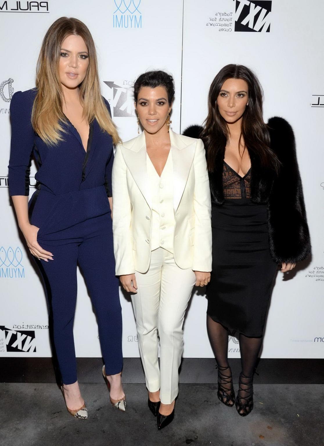 16P Kim Kardashian braless wearing low cut see-through top and skirt at Generation N