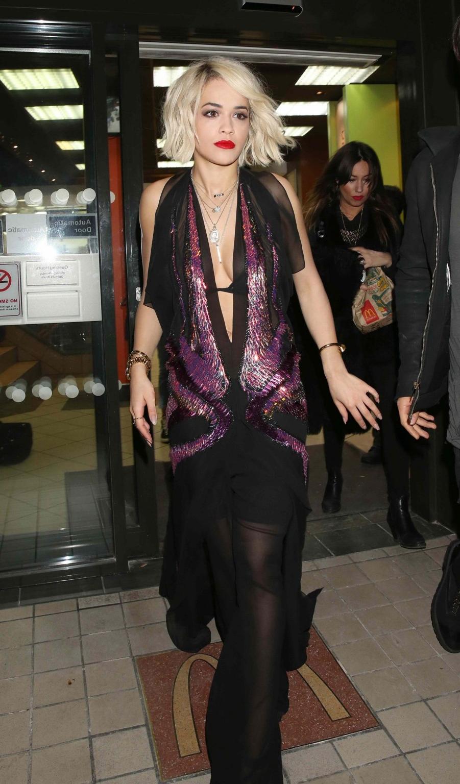 16P Rita Ora wearing revealing black see-through outfit at McDonalds in Holborn, Lon