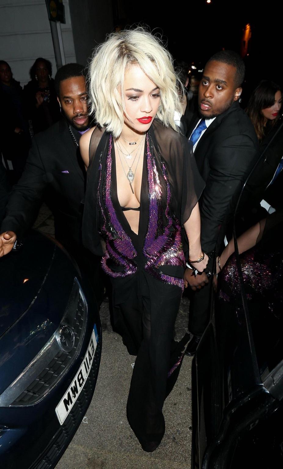 16P Rita Ora wearing revealing black see-through outfit at McDonalds in Holborn, Lon