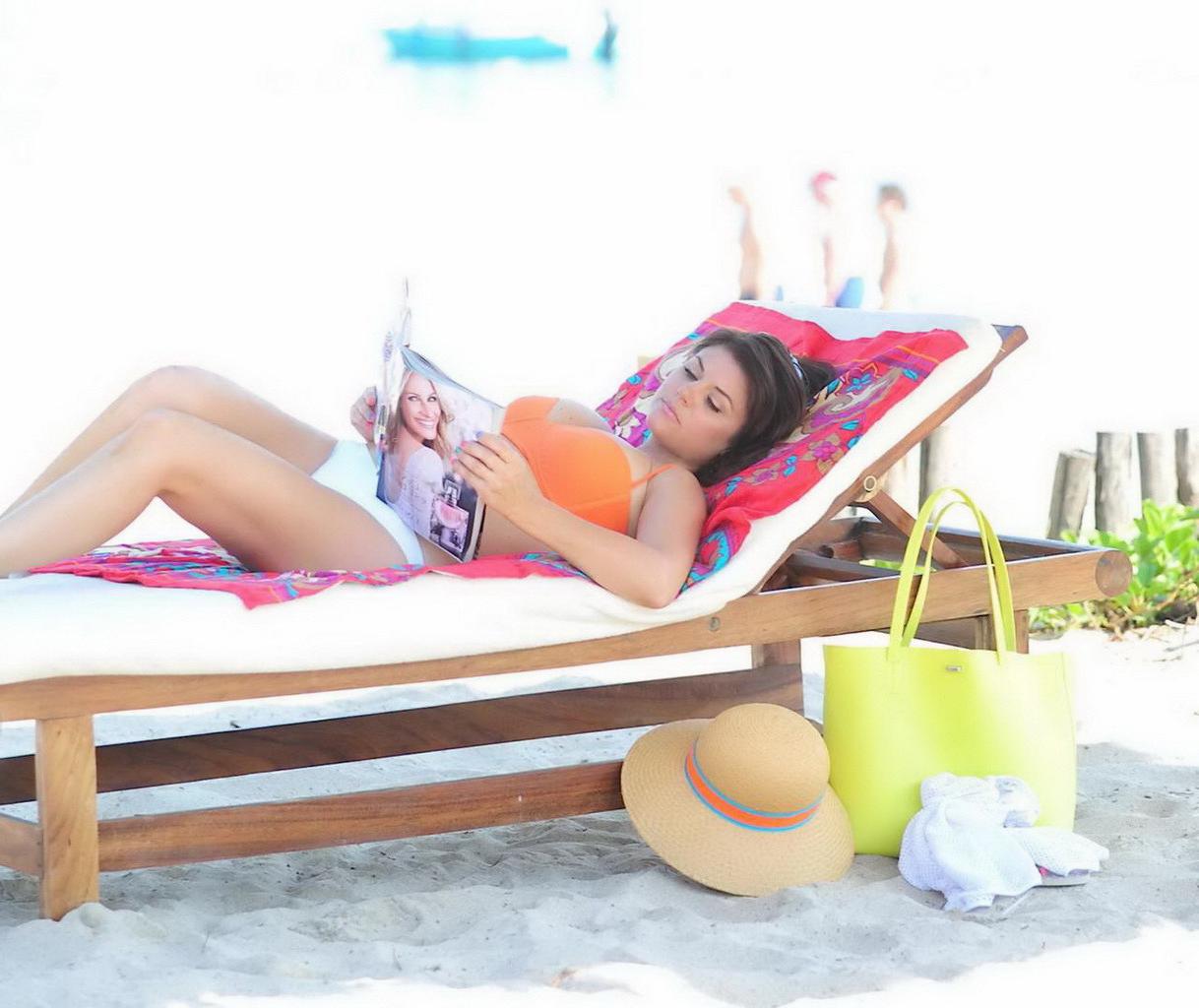 16P Tiffani Thiessen wearing orange bikini top and white panties on the beach in Mex