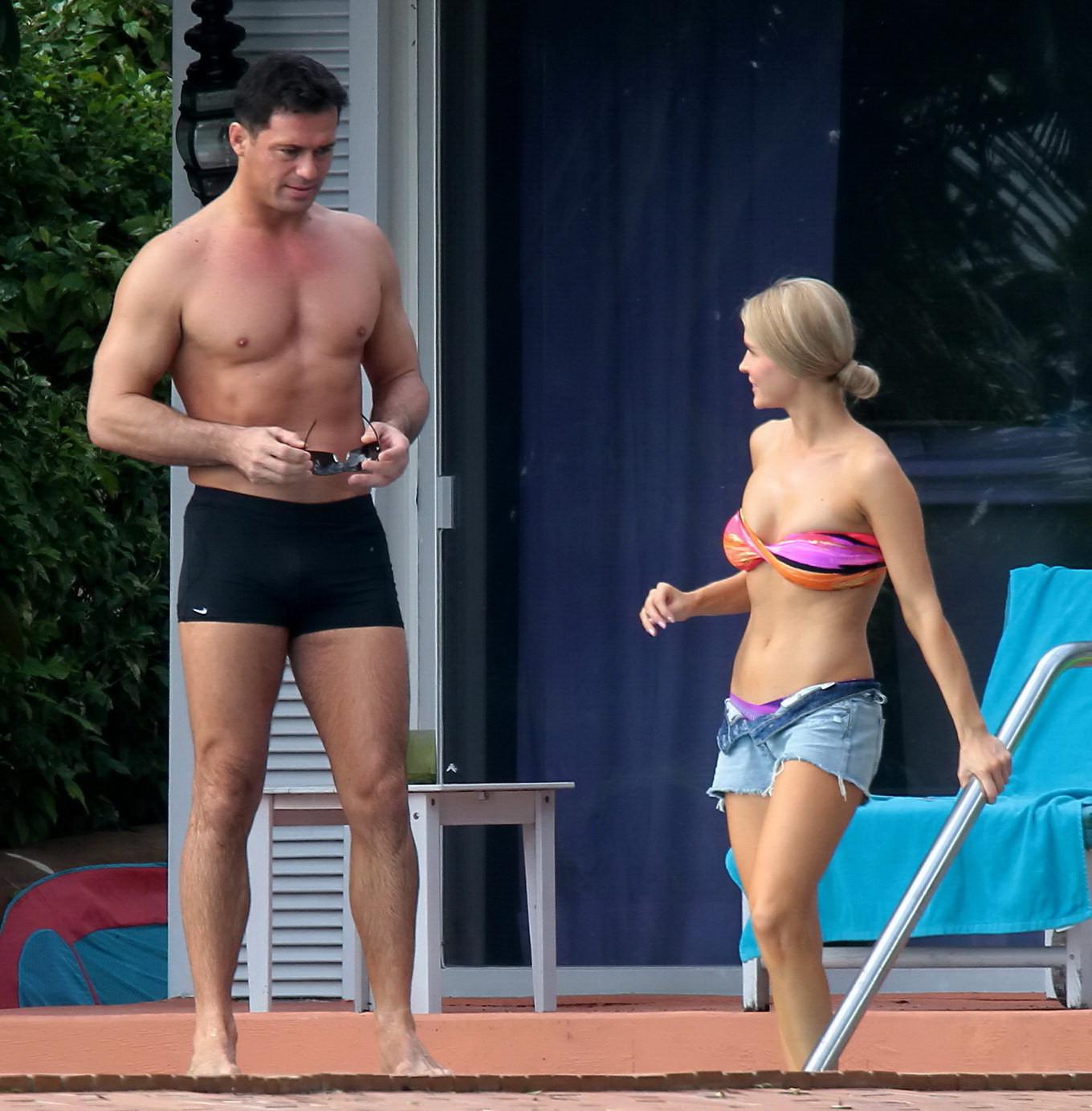 16P Joanna Krupa wearing a strapless bikini top and hotpants poolside in Miami