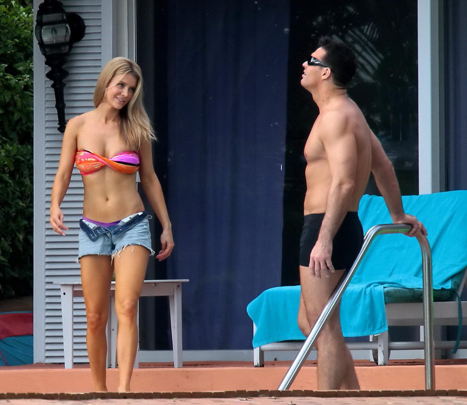 16P Joanna Krupa wearing a strapless bikini top and hotpants poolside in Miami