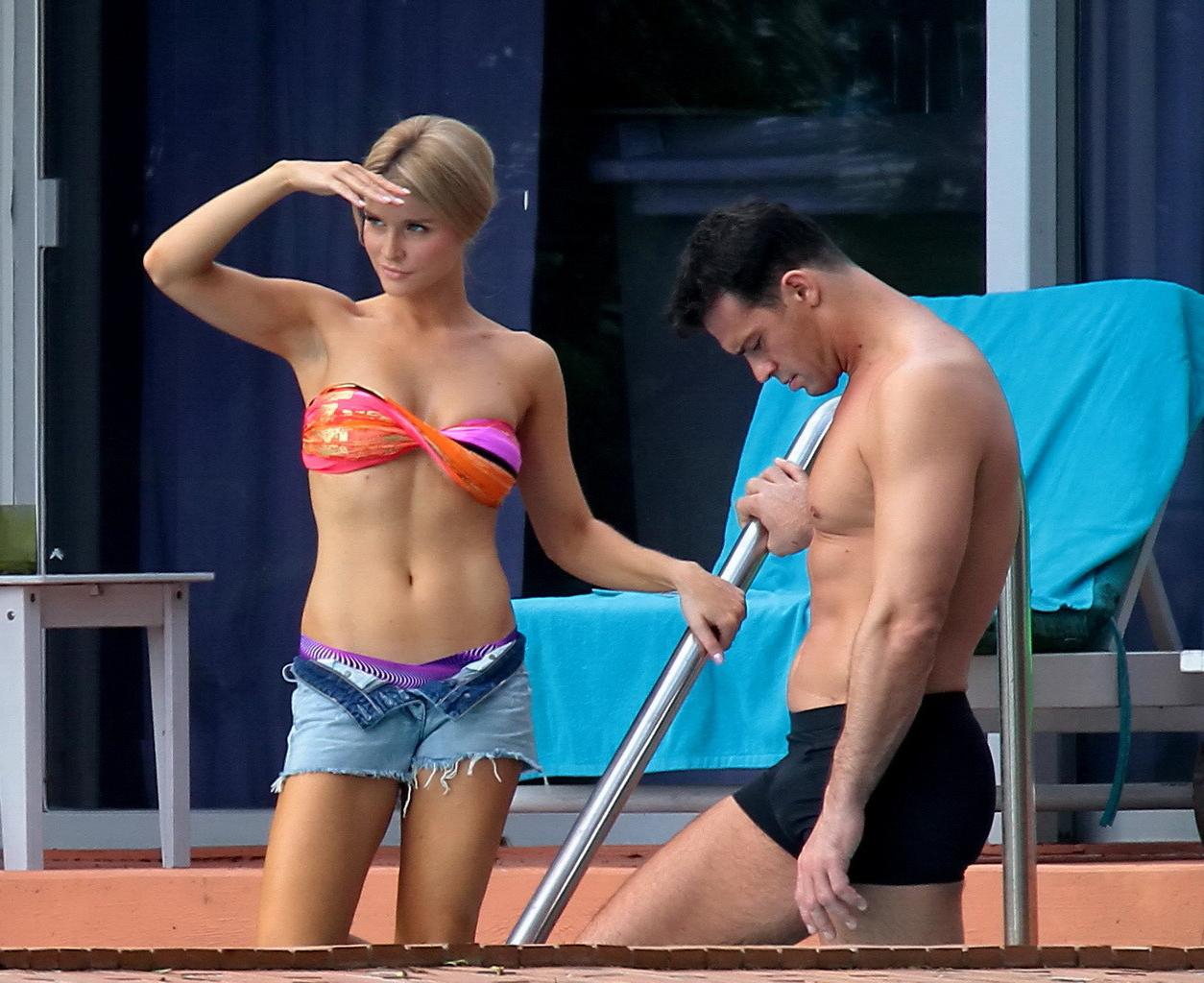 16P Joanna Krupa wearing a strapless bikini top and hotpants poolside in Miami