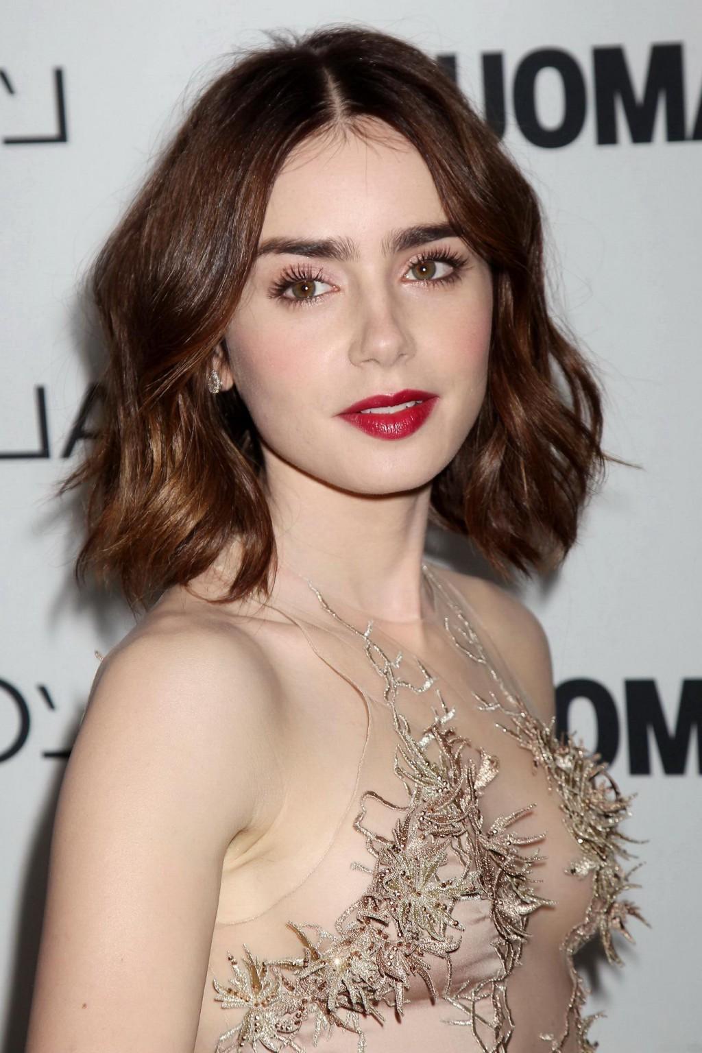 16P Lily Collins braless wearing a partially see-through skin colored dress at the 2