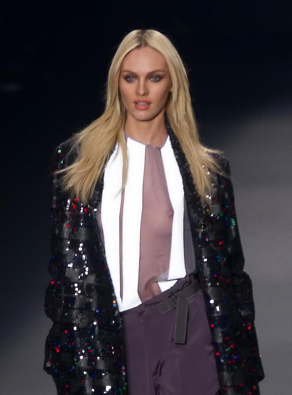 16P Candice Swanepoel shows off her boobs wearing a see through top on the catwalk a