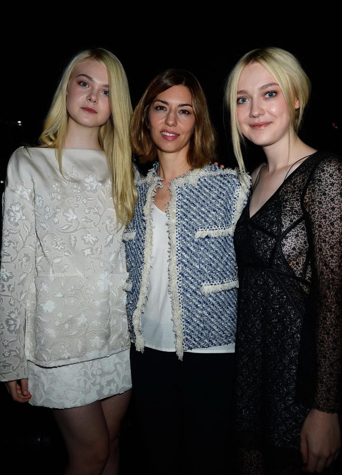 16P Dakota Fanning wearing black see-through dress at Louis Vuitton Spring 2014 Fash
