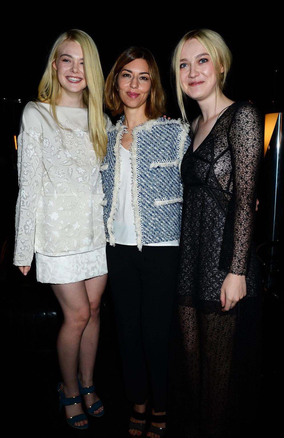 16P Dakota Fanning wearing black see-through dress at Louis Vuitton Spring 2014 Fash