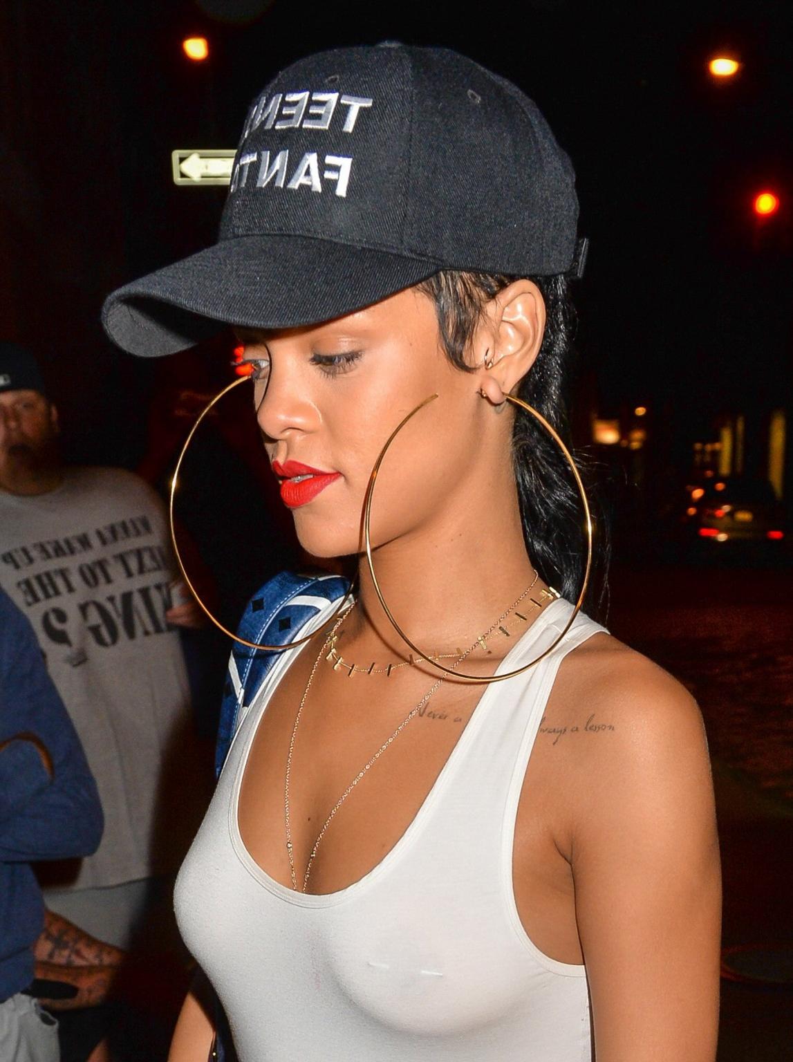 16P Rihanna braless wearing tight white see-through top and hotpants arriving at her