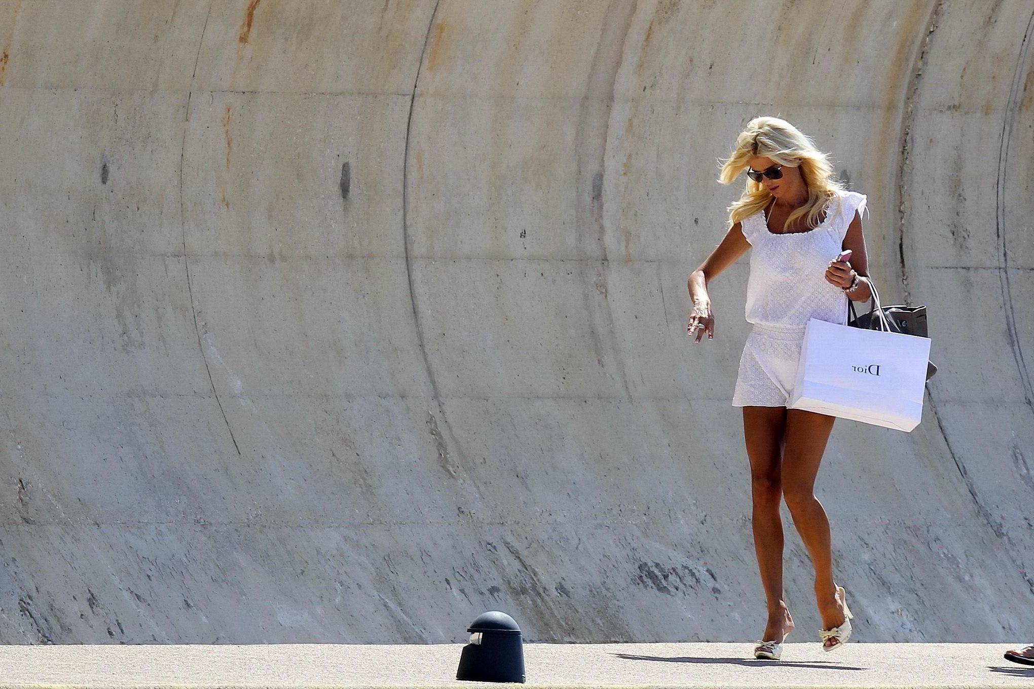16P Victoria Silvstedt see through to bikini while heading to a yach in France