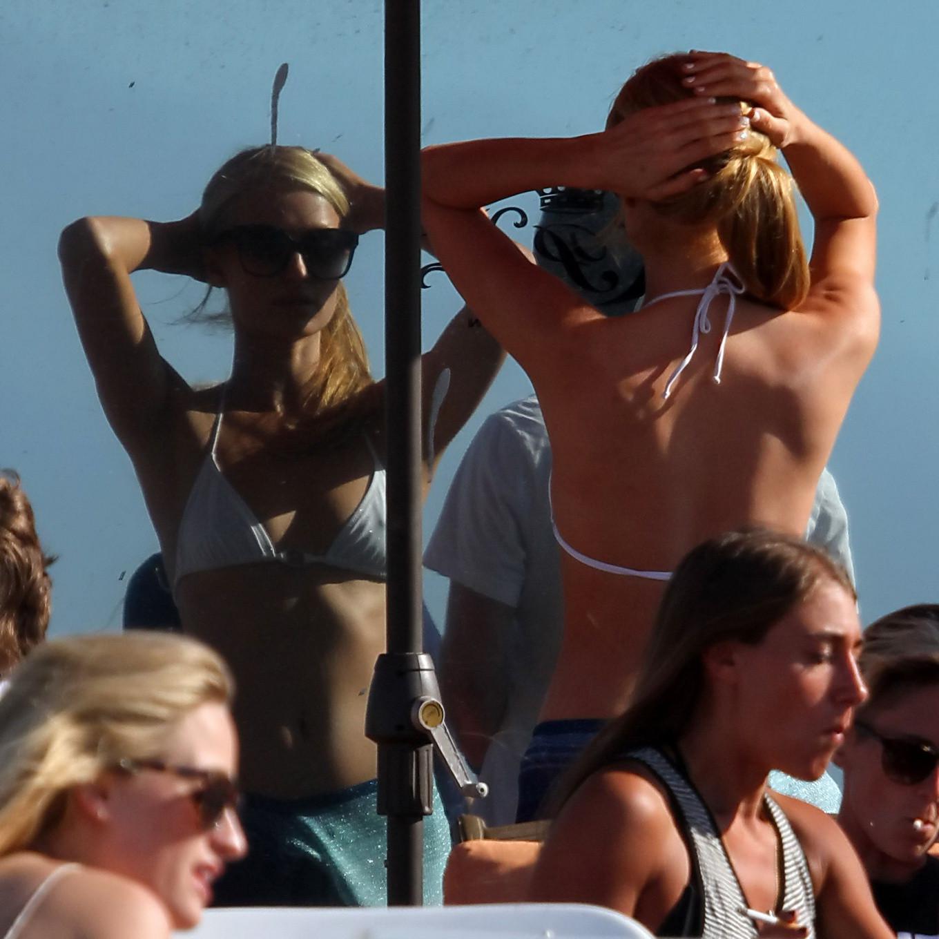 16P Paris Hilton showing her hard pokies in white transparent bikini top on the beac