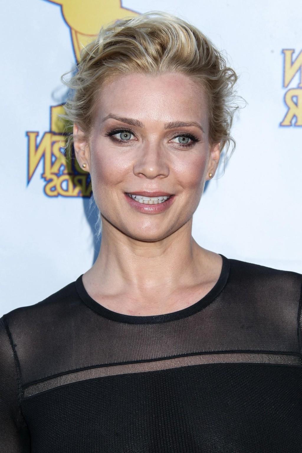 16P Laurie Holden shows off her boobs wearing a tight, slightly see through black dr