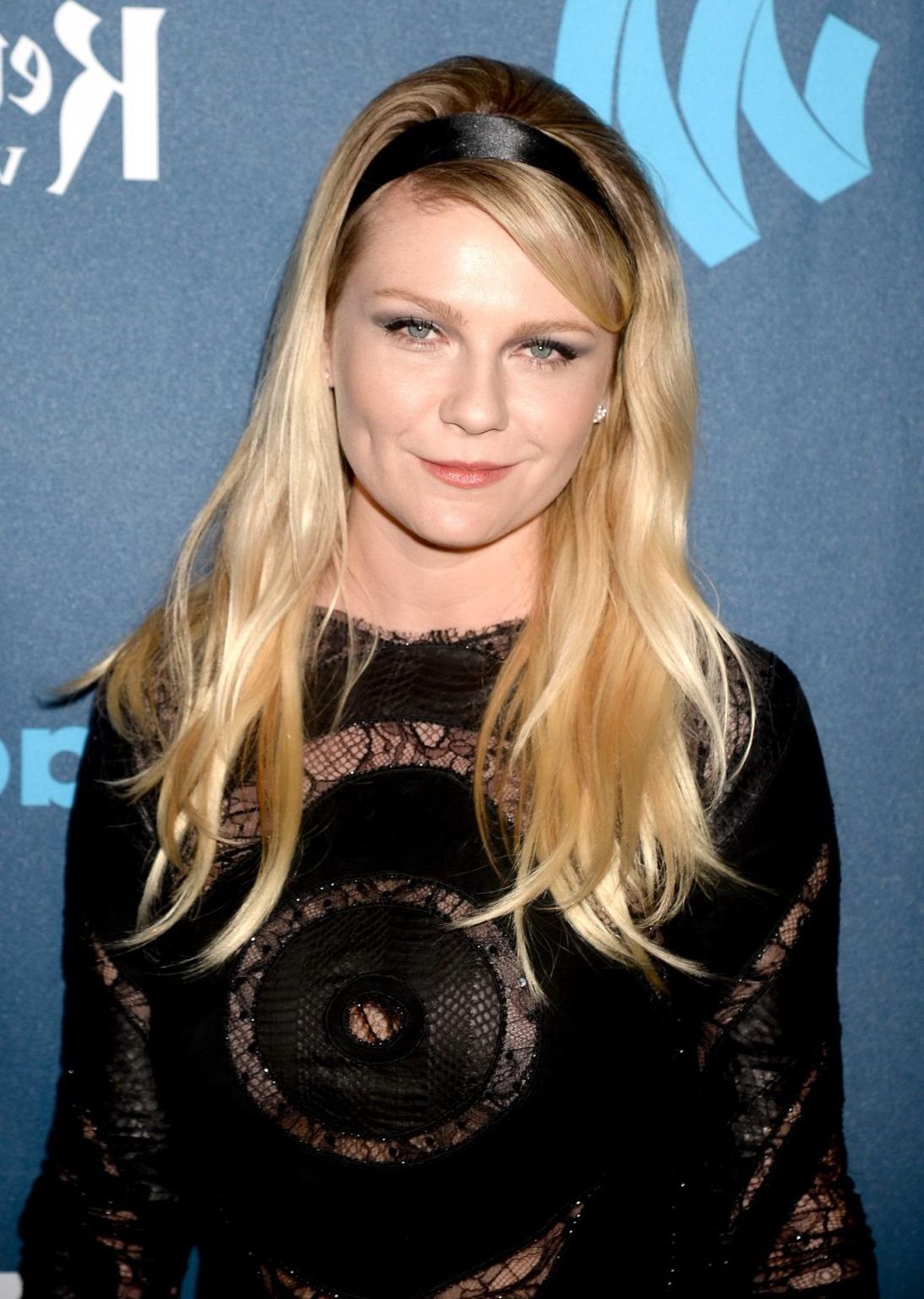 16P Kirsten Dunst wearing a partially see through little dress at the 24th Annual GL