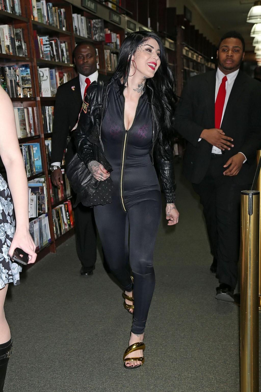 16P Pantyless Kat Von D shows off her ass wearing a see through overalls at Barnes a