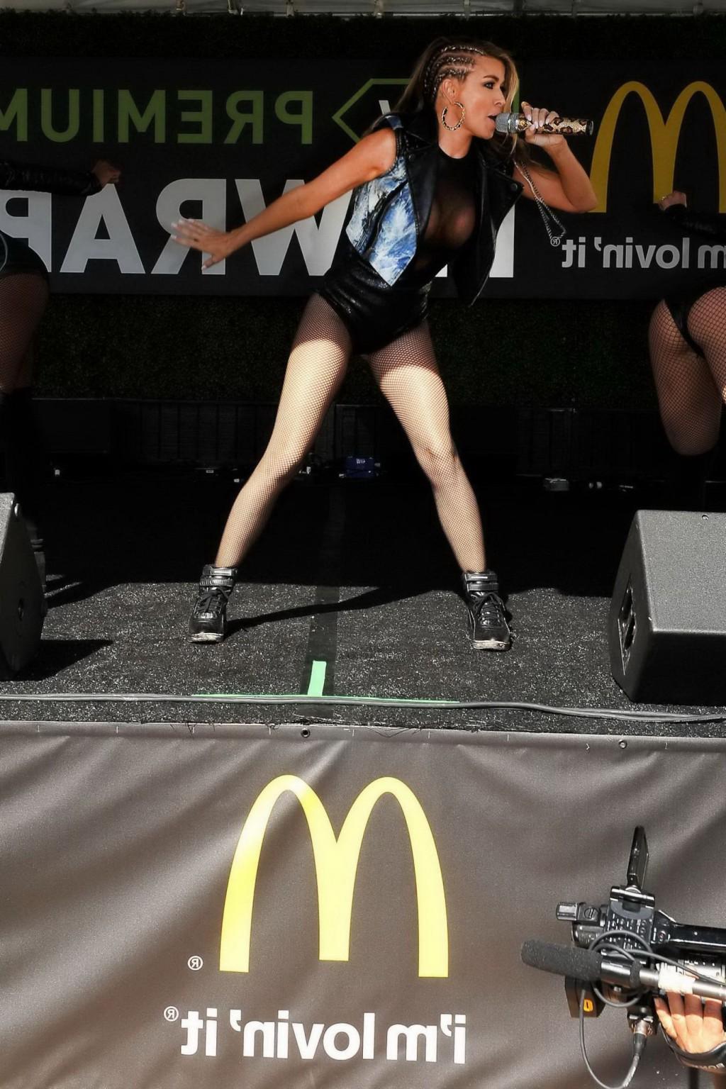 16P Carmen Electra braless wearing see-thru outfit and stockings while performs at B