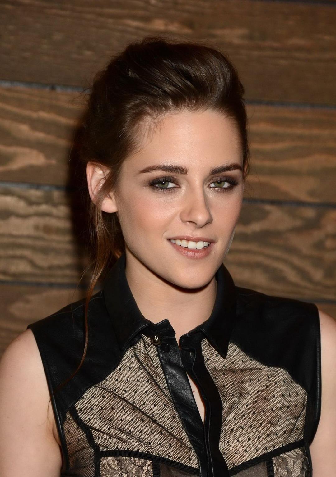 10P Kristen Stewart braless wearing short see-through outfit at On The Road screenin
